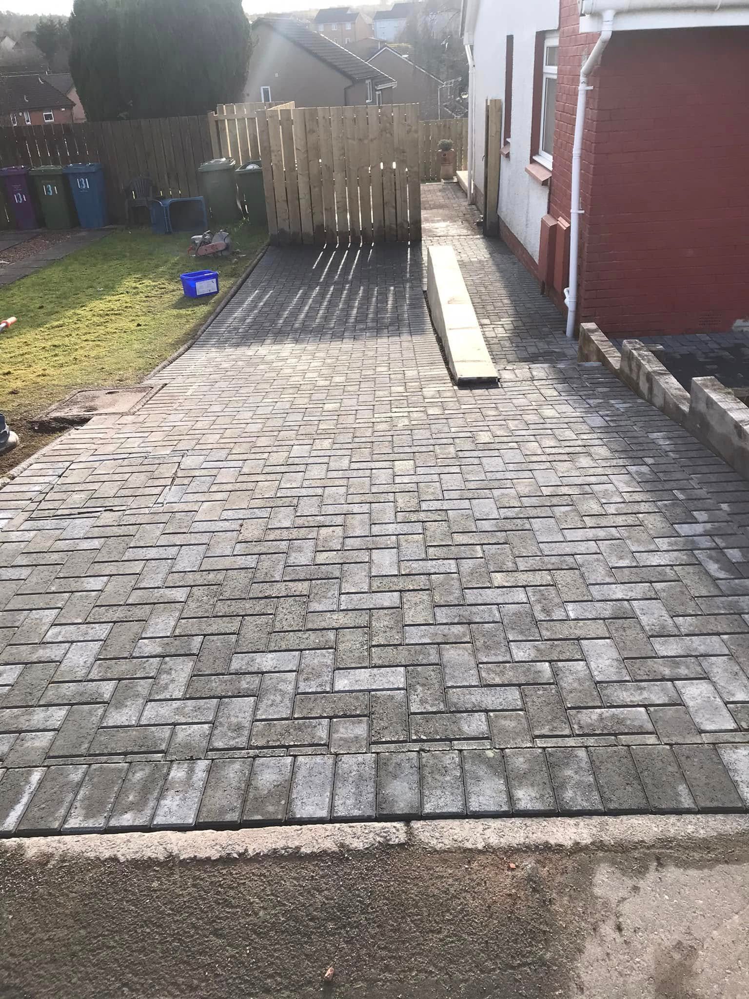 Grey block paving driveway and side path in Glasgow